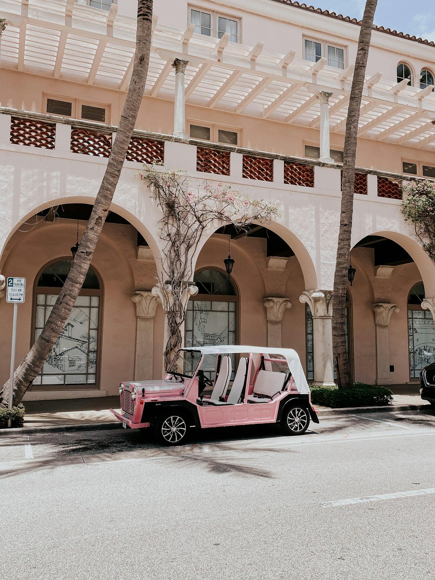 A pink Moke parked beneath the Palm Beach arches